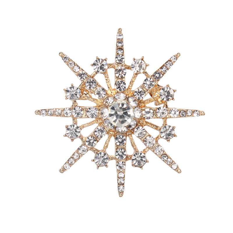 Brosch med diamant och åttauddig stjärnbrosch