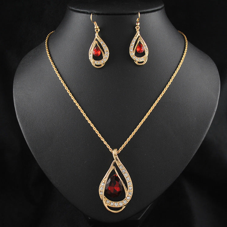 Collier et boucles d'oreilles sertis de cristaux à double goutte