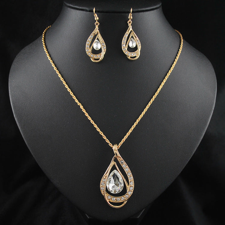 Collier et boucles d'oreilles sertis de cristaux à double goutte