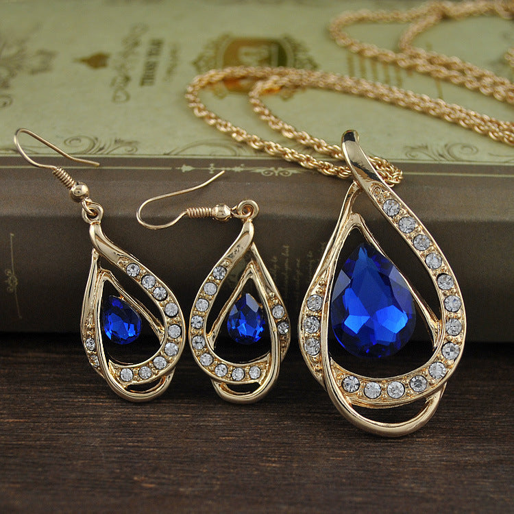 Collier et boucles d'oreilles sertis de cristaux à double goutte