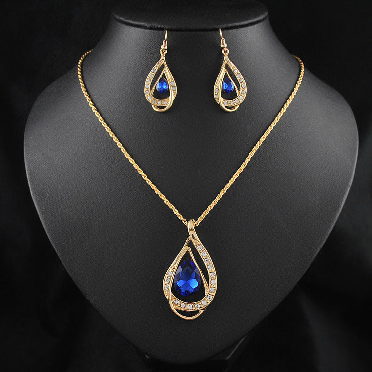 Collier et boucles d'oreilles sertis de cristaux à double goutte