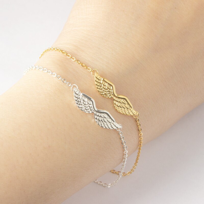Armband med änglavingar i guld och guld