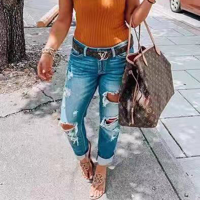 Rippade jeans personlighet kvinnor