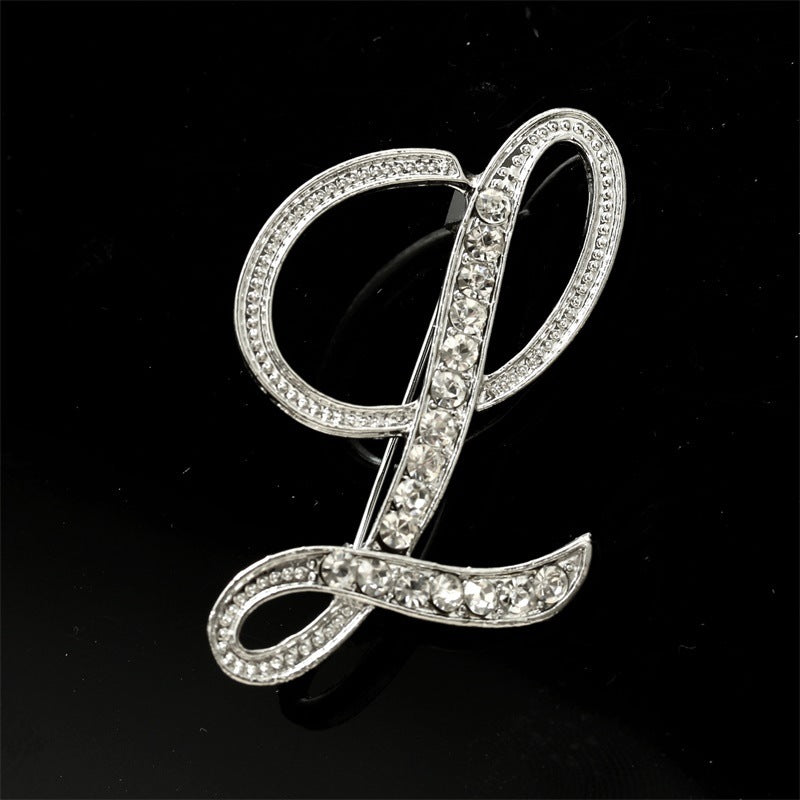 26 engelska alfabetbroscher med diamanter
