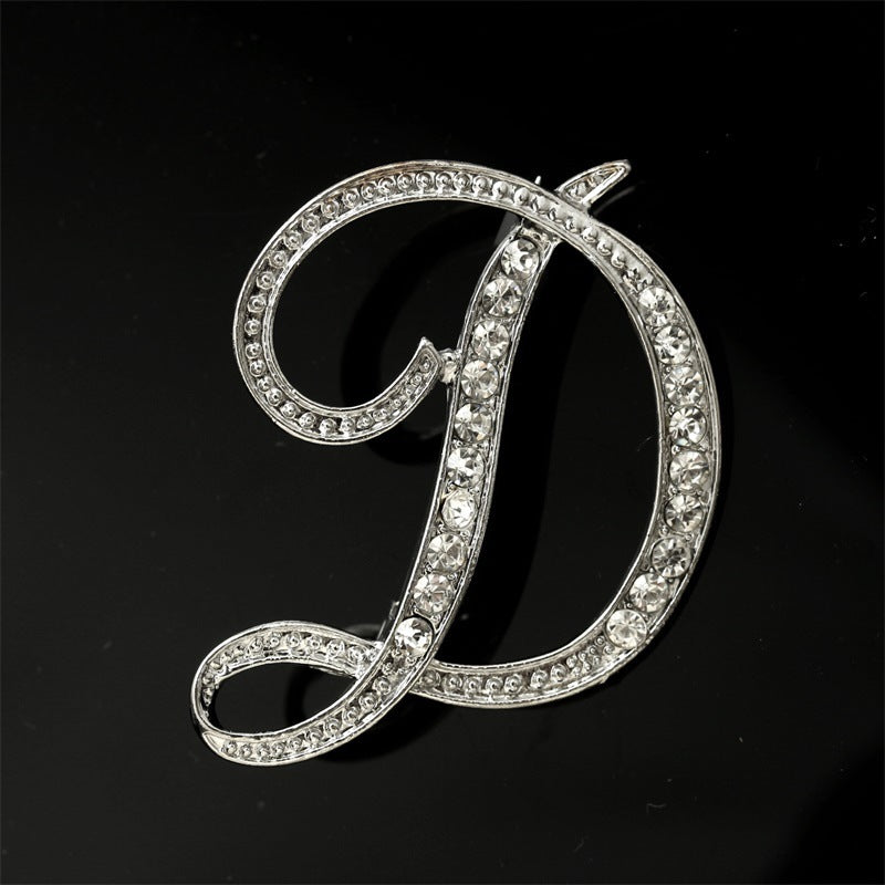 26 engelska alfabetbroscher med diamanter