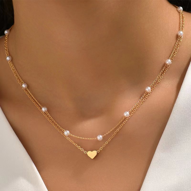 Specialintresserade design dubbellager Twin Pearl Heart halsband