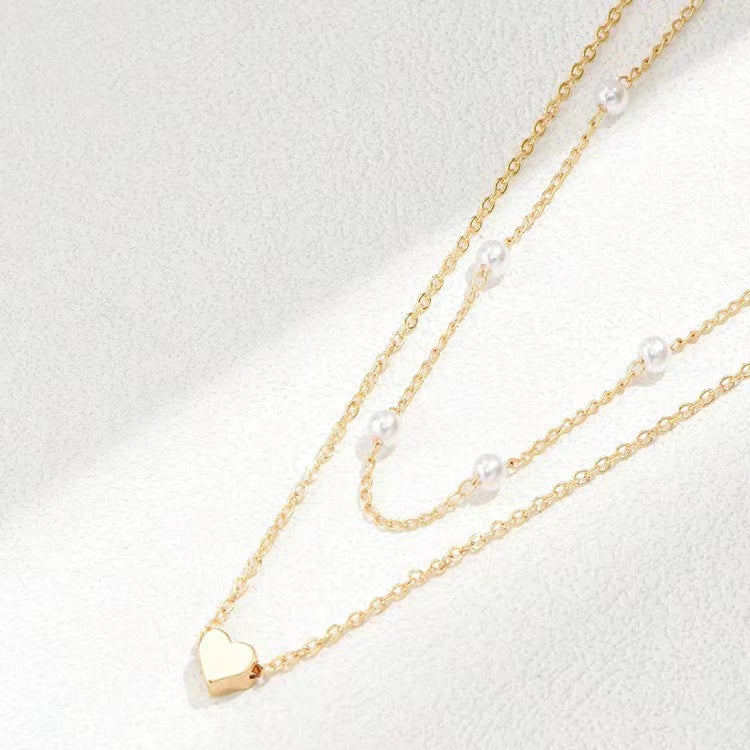 Specialintresserade design dubbellager Twin Pearl Heart halsband
