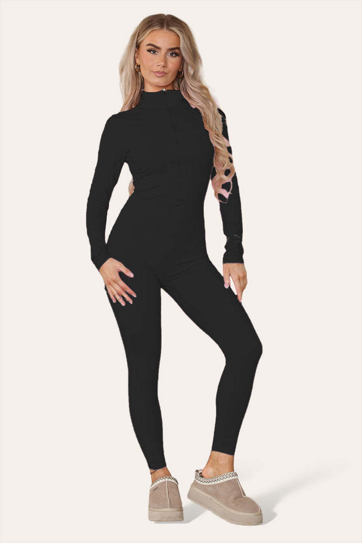 Ribbad jumpsuit med hög halsringning och dragkedja och krage framtill