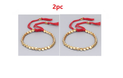 Handgjorda tibetanska buddhistiska armband på handen flätade kopparpärlor lyckorep armband och armband för kvinnor och män