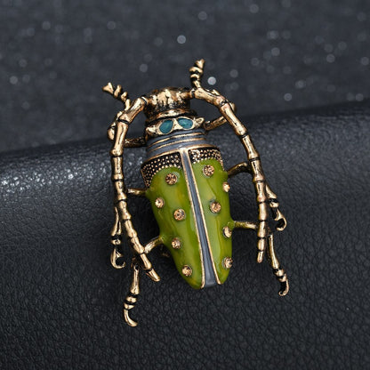 Dripping insect brooch