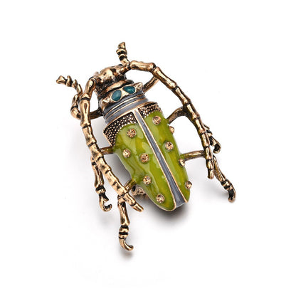 Dripping insect brooch