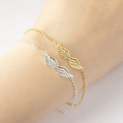 Armband med änglavingar i guld och guld