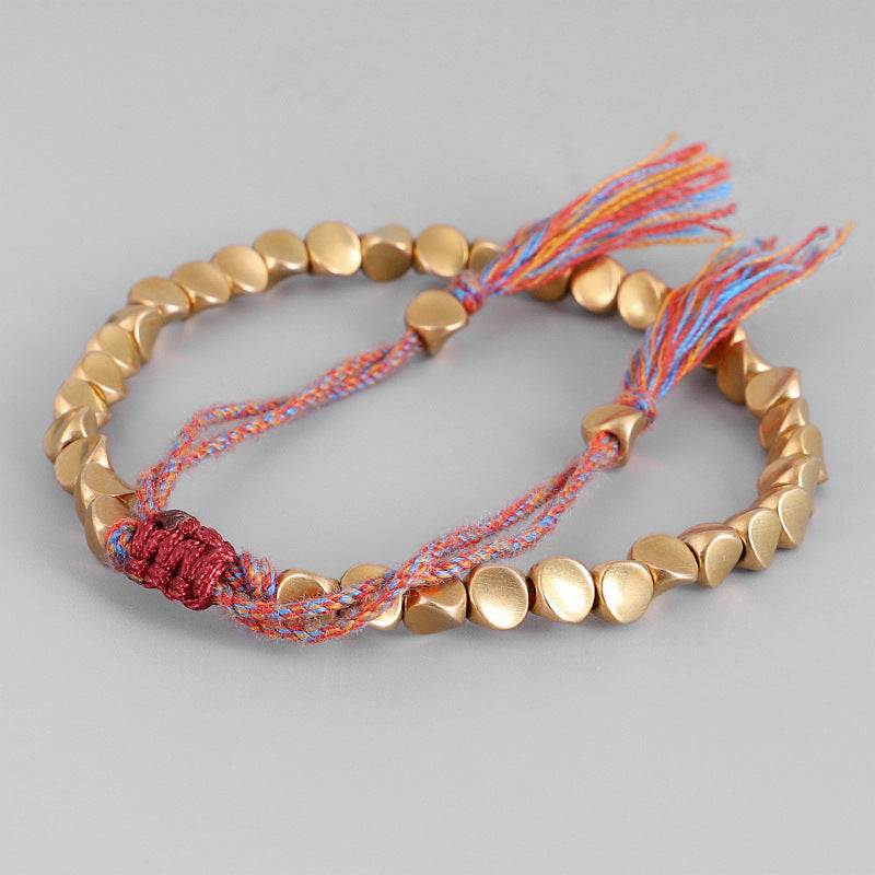 Handgjorda tibetanska buddhistiska armband på handen flätade kopparpärlor lyckorep armband och armband för kvinnor och män