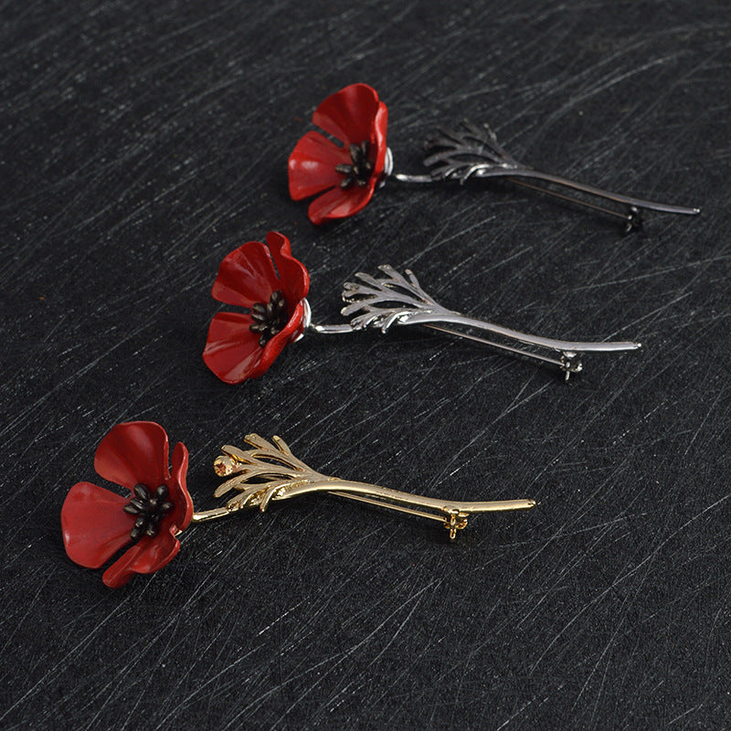 Broche fleur rouge