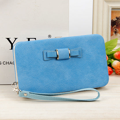 Factory spot low price wholesale new Korean version of women's wallet in the long money bag butterfly knot lunch box woman bag tide