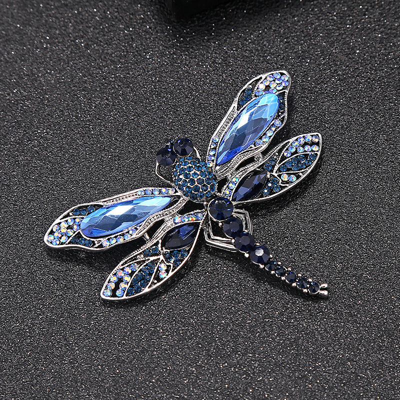 Broche libellule en strass