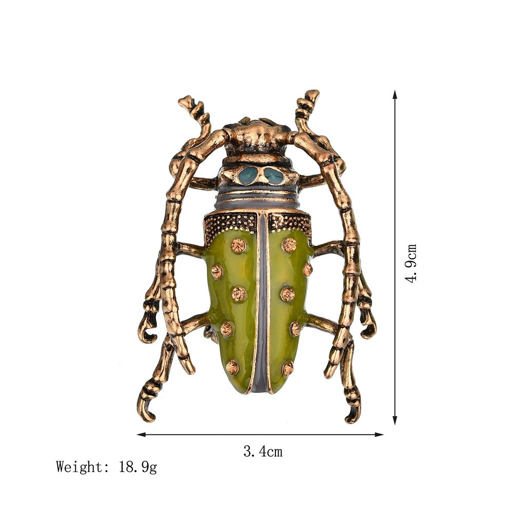 Droppande insektsbrosch