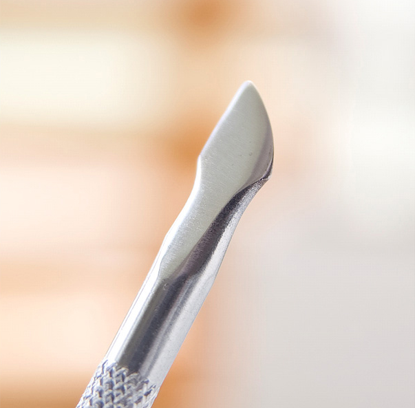 Manicure care with double-headed nail remover