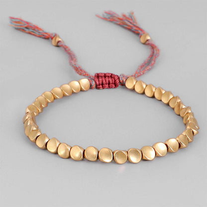 Handgjorda tibetanska buddhistiska armband på handen flätade kopparpärlor lyckorep armband och armband för kvinnor och män