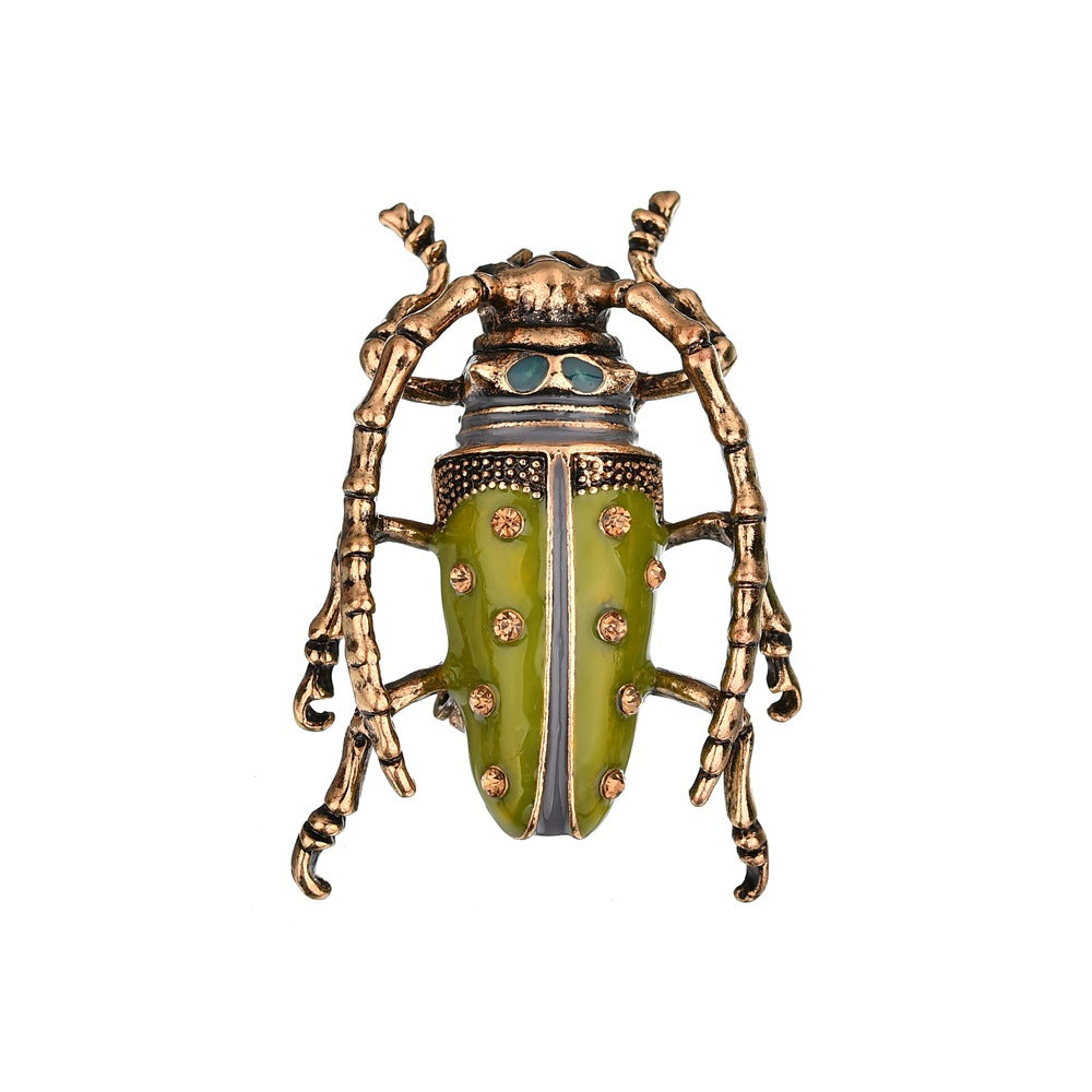 Dripping insect brooch