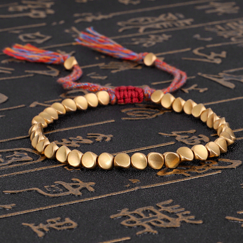 Handgjorda tibetanska buddhistiska armband på handen flätade kopparpärlor lyckorep armband och armband för kvinnor och män