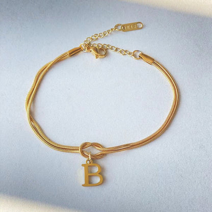 Nya bokstaven AZ kärleksknut armband för kvinnor par guldfärg läcker ormkedja berlockarmband rostfritt stål smycken present alla hjärtans dag presenter